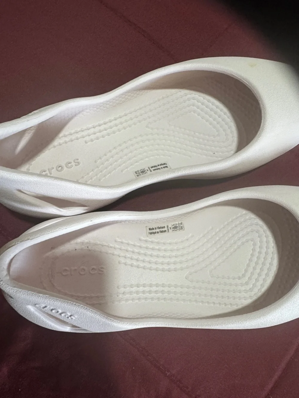 CROCS kids pink Slip-On Ballet Flats they have a little stain on left shoe